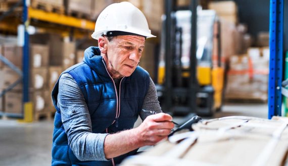 portrait-of-a-senior-male-warehouse-worker-or-a-su-F59H23T.jpg